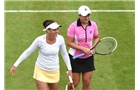 BIRMINGHAM, ENGLAND - JUNE 14: Casey Dellacqua (L) and Ashleigh Barty (R) of Australia smile during their match against Caroline Garcia of France and Shuai Zhang of China on day six of the Aegon Classic at Edgbaston Priory Club on June 13, 2014 in Birmingham, England. (Photo by Tom Dulat/Getty Images)